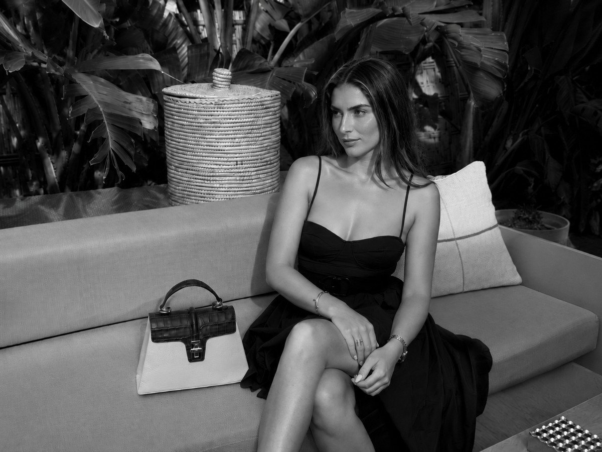 The Monaco resting on a terrace bench