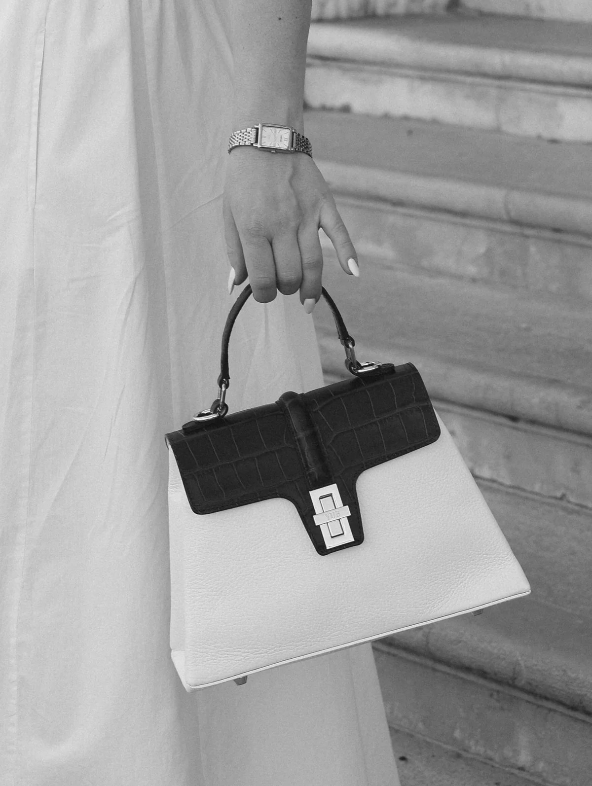 The Monaco carried on a stone stair